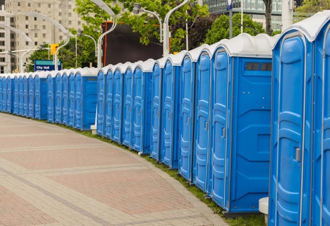 a row of portable restrooms set up for a large athletic event, allowing participants and spectators to easily take care of their needs in Clyde Hill, WA